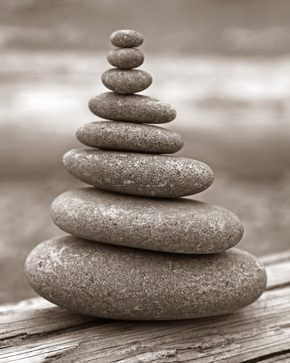 A stack of rocks sitting on top of a wooden table